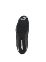 Alpinestars Celer Superair Shoes, Motorcycle Riding Shoes, Black and White, bottom view showing the oil-resistant rubber outsole with textured tread, white Alpinestars logo on the heel and brand name along the center for grip and performance