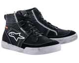 Alpinestars Ageless Riding Shoes, Urban Motorcycle Footwear, Black with white contrast stitching and soles, high-top sneaker silhouette featuring a large white star logo on the side, casual protective gear for road riding