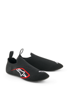 Alpinestars Tech Gaming Shoes, Sim-Racing Footwear, Black, featuring a seamless knitted stretch upper, white embroidered logo with red accents, low-profile sock-like design with rear pull tabs, optimized for pedal sensitivity
