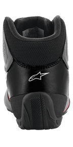 Alpinestars Tech-1 K Start V2 Shoes, Karting Shoes, Asphalt Black Orange Fluo, rear view showing the white Alpinestars logo, mesh Achilles collar, and reinforced rubber heel counter for stability.