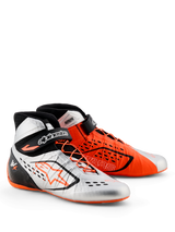 Alpinestars Tech-1 KX V3 Shoes - FIA, Karting Shoes, Black Silver and Orange Fluo, mismatched color design with one silver shoe and one orange shoe, featuring asymmetrical lacing and adjustable ankle straps, sleek lightweight construction for racing performance