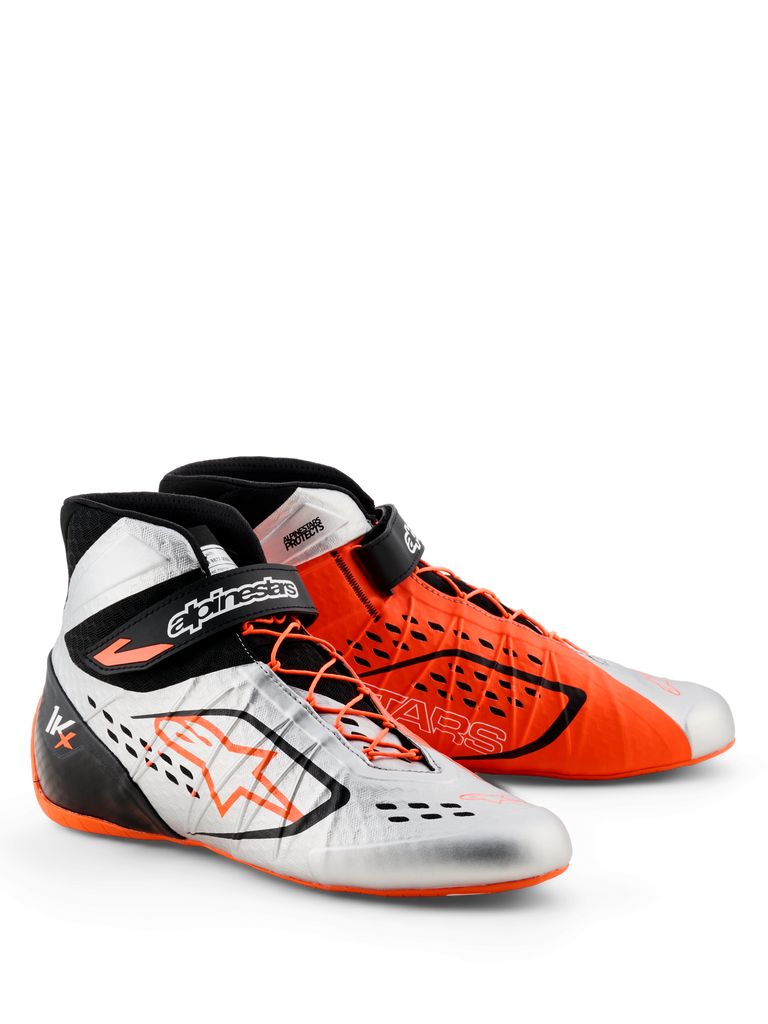 Alpinestars Tech-1 KX V3 Shoes - FIA, Karting Shoes, Black Silver and Orange Fluo, mismatched color design with one silver shoe and one orange shoe, featuring asymmetrical lacing and adjustable ankle straps, sleek lightweight construction for racing performance