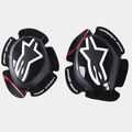 Alpinestars GP Pro Knee Sliders, Black, featuring white Alpinestars star logo, 'one goal. one vision.' text on the edges, red accent stripe on textured wings, anatomically shaped polymer compound for motorcycle racing gear