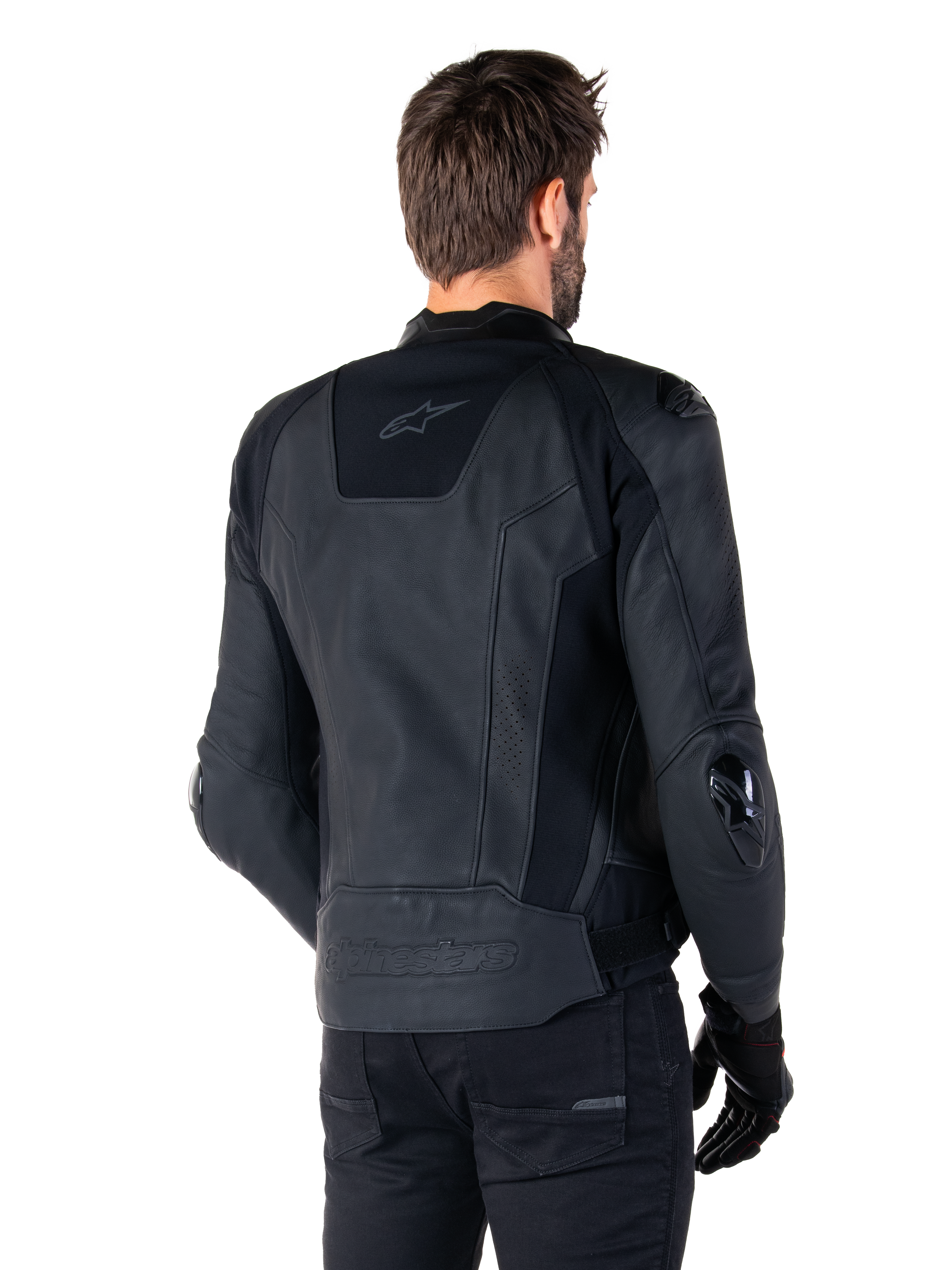 Alpinestars Missile V3 Leather Jacket, Black, rear view on model, premium racing sport jacket with leather construction, featuring embossed Alpinestars branding on the lower back and TPU elbow sliders.