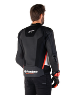 Alpinestars Missile V3 Airflow Leather Jacket, Rear View, Black White and Red Fluo, featuring extensive perforations for cooling, external DFS sliders on shoulders and elbows, and Alpinestars branding on the lower back.