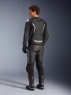 Alpinestars GP Force V2 Air Leather Jacket, Black and White, rear view on model featuring perforated back panel for ventilation, white branding and red star logo, worn with matching leather racing pants, gloves, and boots