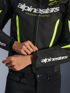 Alpinestars GP Force V2 Air Leather Jacket, Black Yellow Fluo, close-up of perforated leather construction and high-visibility accents, featuring prominent branding and 'RACING AHEAD' graphic, sporty design for motorcycle performance