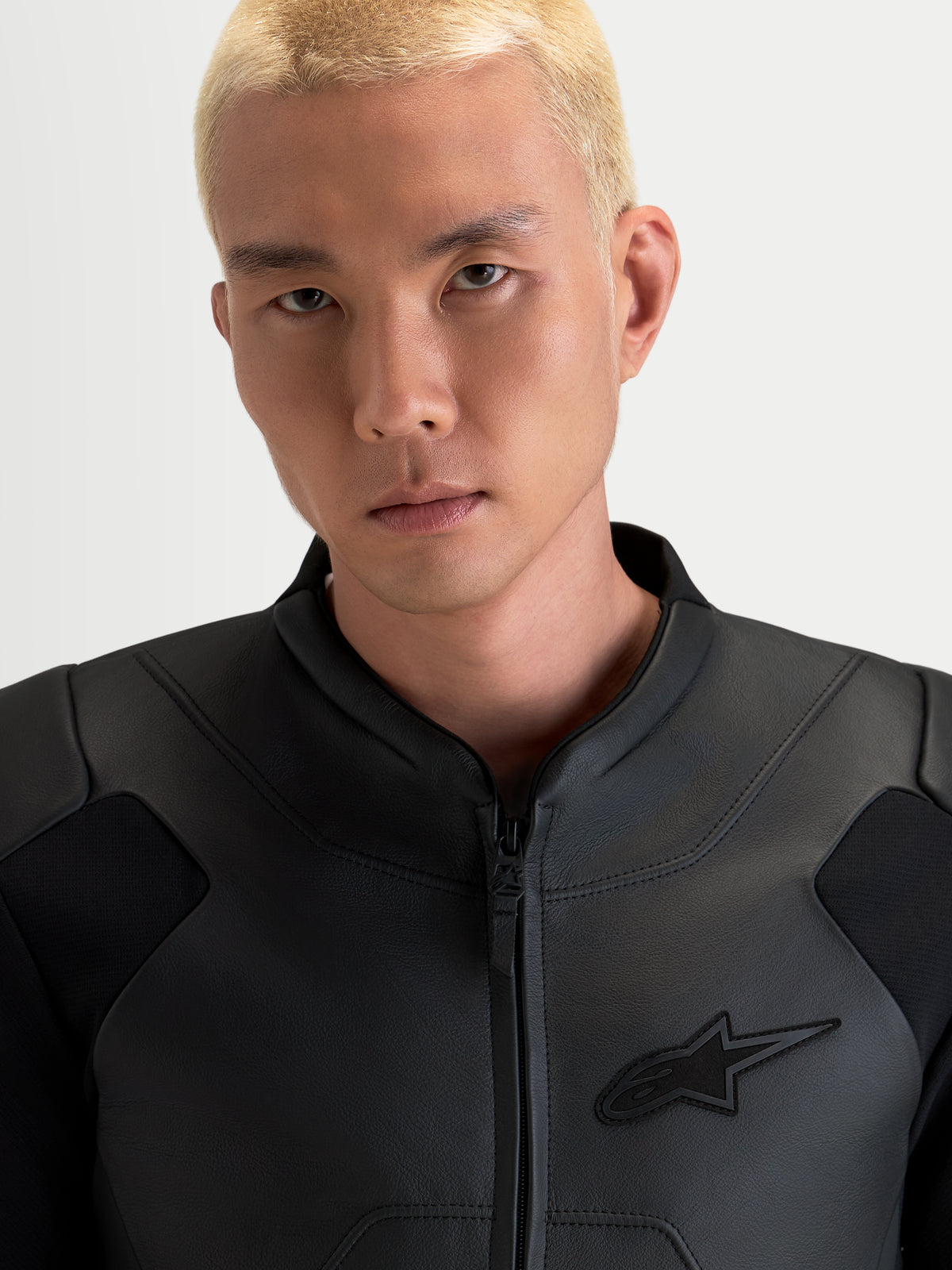 Alpinestars Caliber V2 Leather Jacket, Men's Black motorcycle jacket, close-up portrait showing ergonomic collar and premium full-grain bovine leather construction