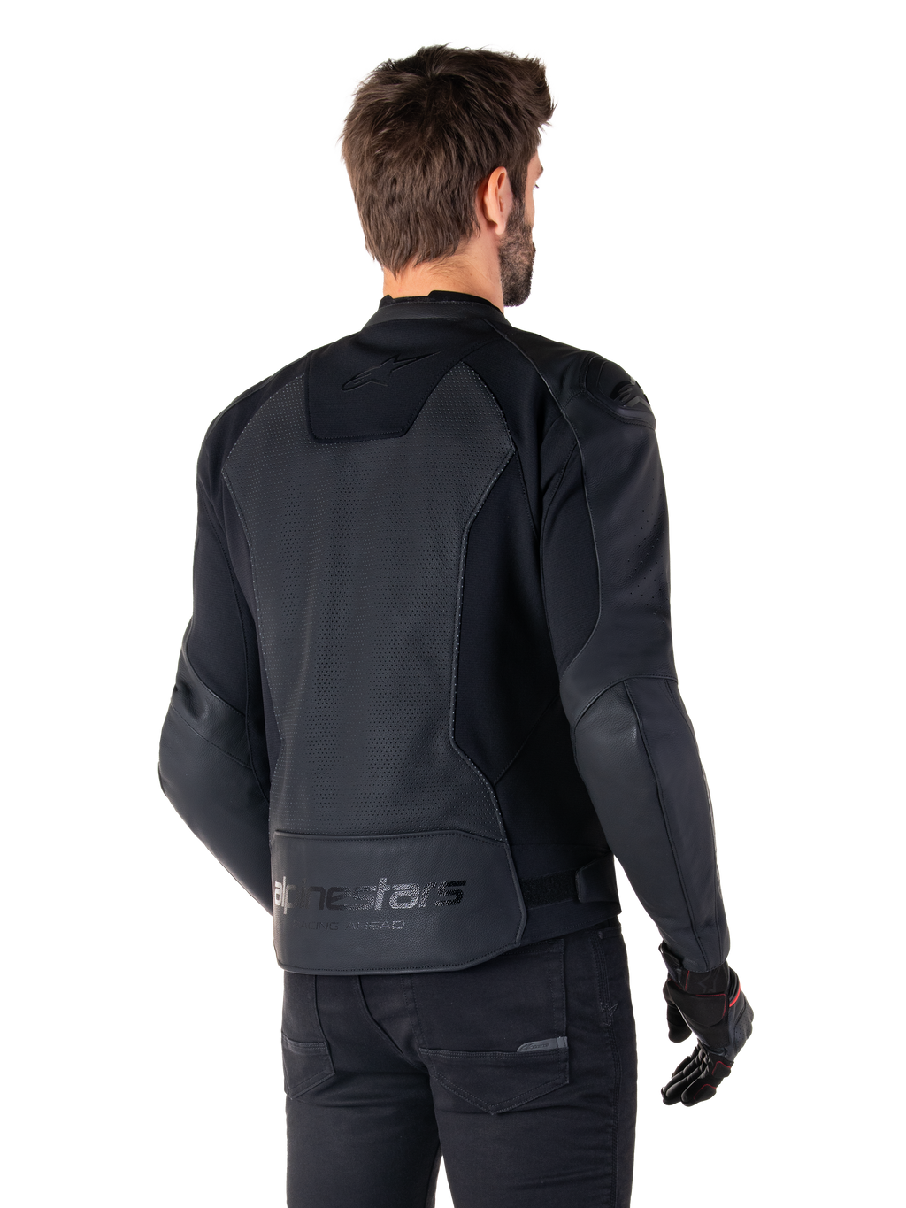 Alpinestars Faster V3 Airflow Leather Jacket, Black, Rear view of a man wearing a sport leather motorcycle jacket, featuring perforated back panels, stretch inserts, and Alpinestars branding on the lower hem, paired with black pants and gloves