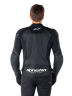 Alpinestars Faster V3 Airflow Leather Jacket, Black and White, rear view of a rider showing the perforated leather back panel for ventilation, white Alpinestars logo on upper back and 'RACING AHEAD' branding on lower back, sport-fit motorcycle gear.