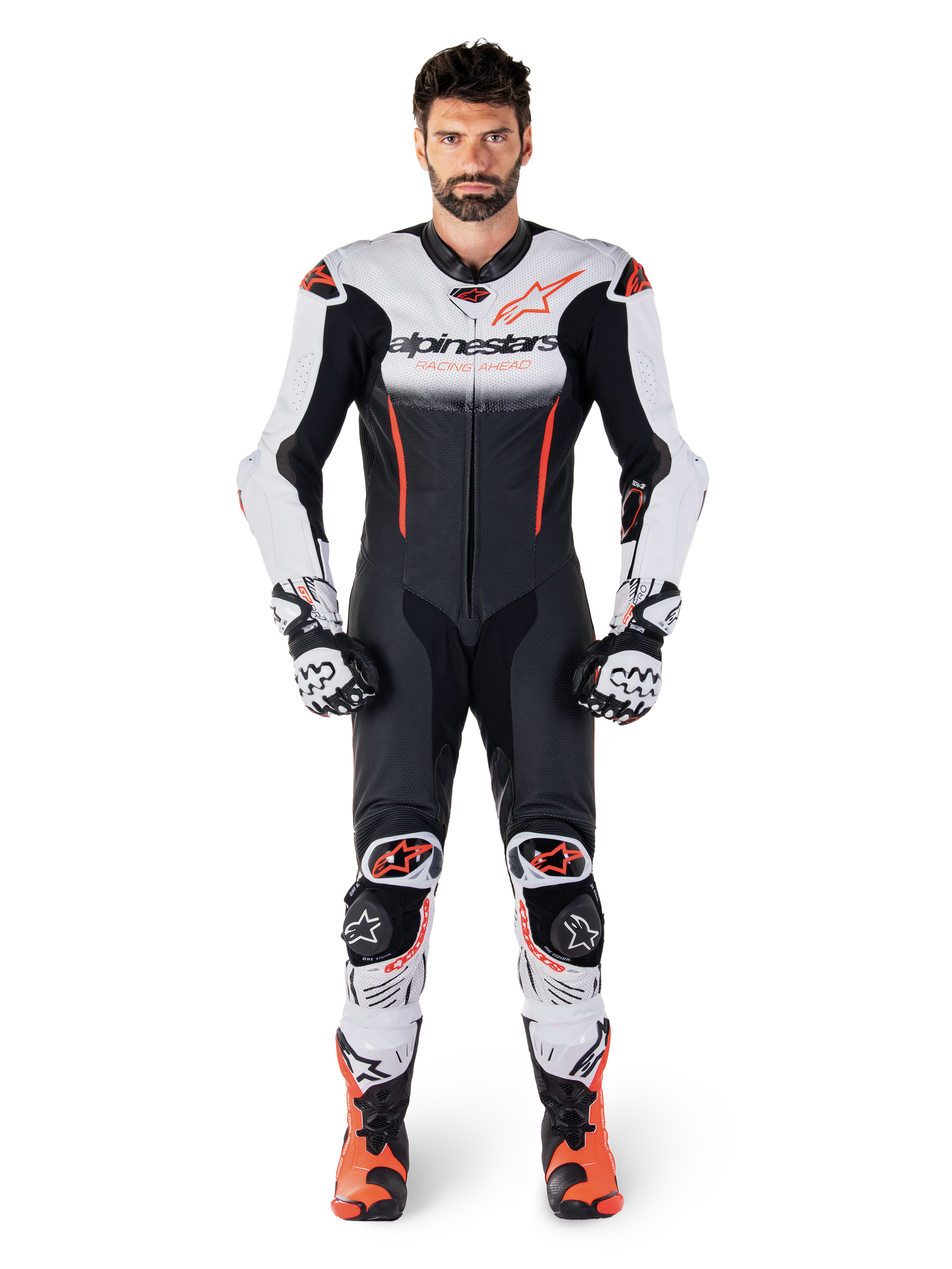 Male rider wearing the Alpinestars GP-R7 One Piece Leather Suit in White Black and Red Fluo, coordinated with matching racing gloves and boots, professional motorcycle track gear featuring a streamlined race fit and bold branding