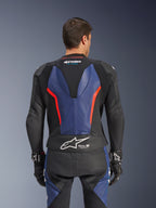 Alpinestars GP Force V2 Leather Suit 2-Piece, Back view, Black with Blue and Red Fluo accents, featuring perforated leather construction, Tech-Air Ready branding on the waist, and ergonomic stretch panels for racing performance.