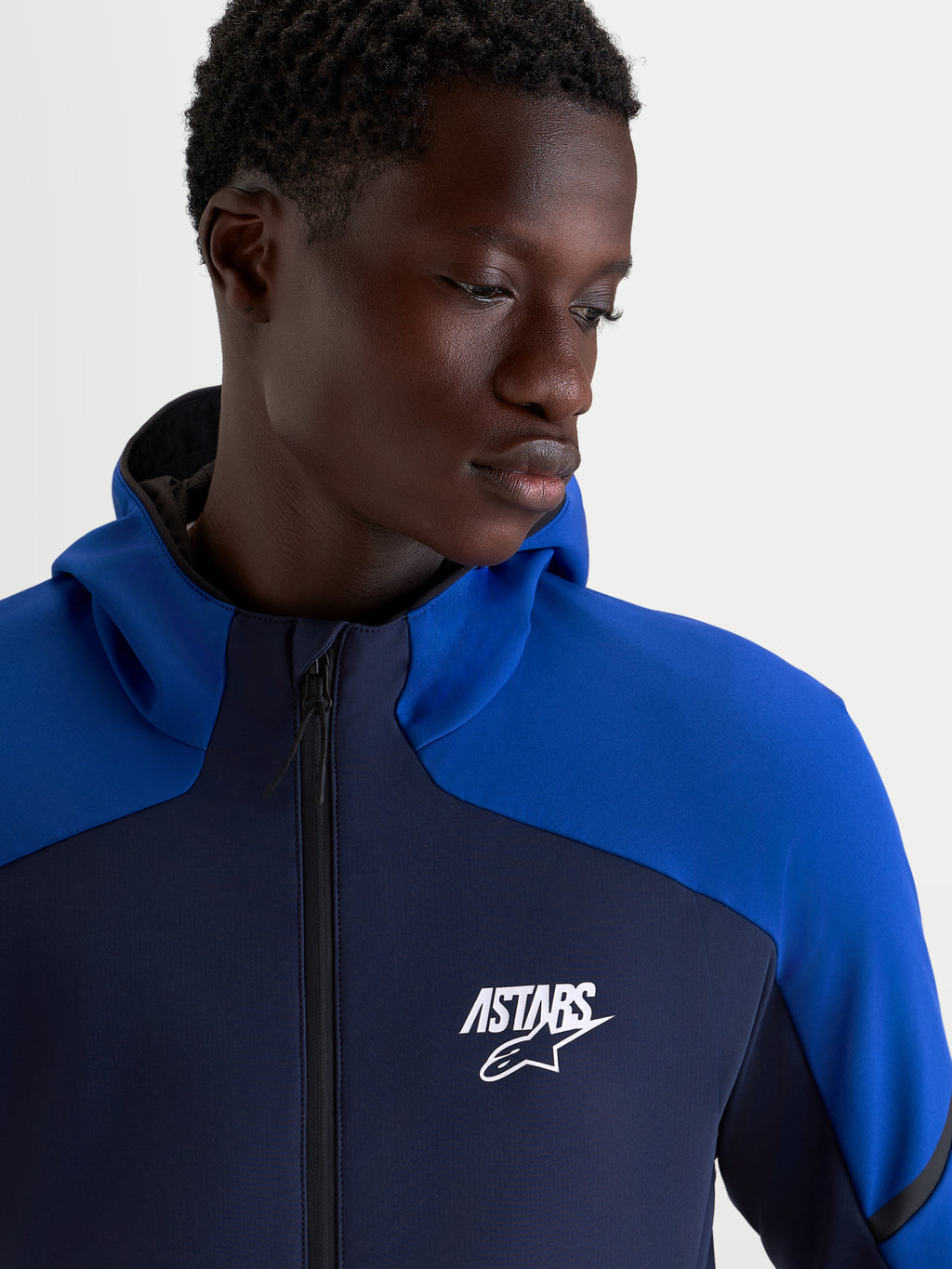 Alpinestars Aeroshell Waterproof Jacket, Men's Night Navy and Bright Blue motorcycle sport hoodie with a white ASTARS logo and waterproof front zipper