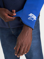 Alpinestars Aeroshell Waterproof Jacket, close-up view of the sleeve cuff detail showcasing the A-stars logo, Night Navy and Bright Blue, men's motorcycle textile jacket