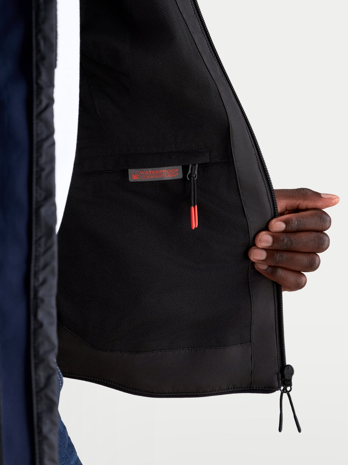 Alpinestars Aeroshell Waterproof Jacket, close-up view of the interior lining showcasing the waterproof compartment and zipper pocket, Night Navy and Black, CE certified motorcycle gear