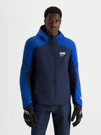 Alpinestars Aeroshell Waterproof Jacket, men's night navy and bright blue motorcycle sports softshell jacket with a hoodie, worn by a model