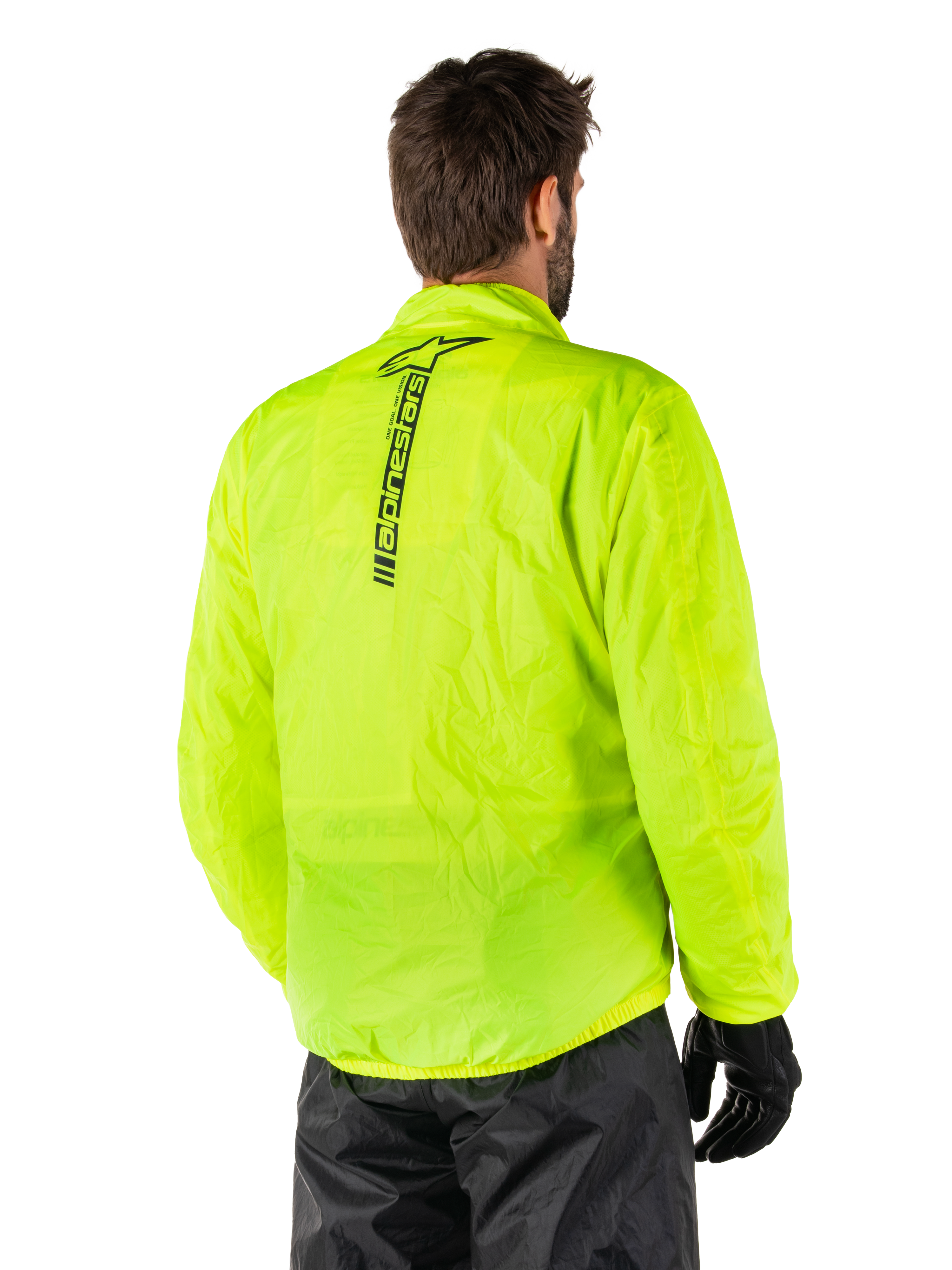 Alpinestars Hurricane Rain V2 Jacket, Yellow Fluo, rear view worn by male model, featuring vertical black Alpinestars wordmark on center back, elasticated waist and cuffs, waterproof and packable design
