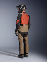 Alpinestars Andes V4 Drystar® Jacket, Walnut Rust Black colorway, back view of a rider wearing matching adventure pants, black helmet, and black riding boots, technical textile motorcycle gear for all-weather adventure touring.