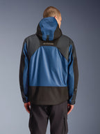 Alpinestars Mospher Waterproof Jacket in Black Dark Petrol, rear view of a motorcycle parka featuring blue ripstop panels and black reinforced sections, MO.ST.EQ. branding on the upper back, modern urban tactical design