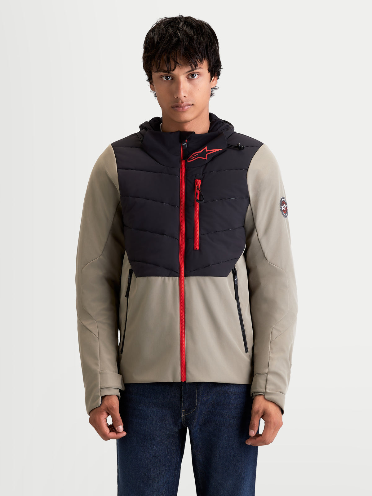 Alpinestars Therma-Tech Waterproof Jacket, men's urban contemporary motorcycle jacket in black and vetiver, front view on a model wearing the insulated textile jacket with a hood and red zipper accents.