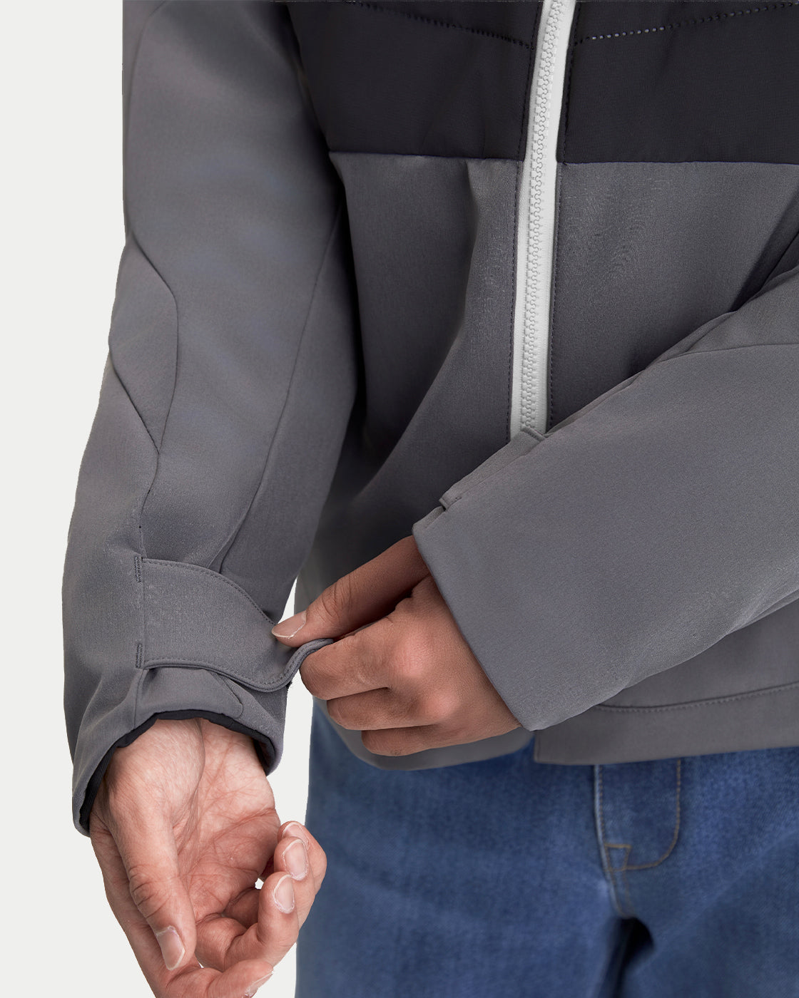 Alpinestars Therma-Tech WP Jacket, waterproof technical jacket in gray and black, close-up view showing adjustable velcro cuff closure and front zipper detail