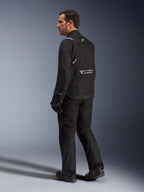 Alpinestars Cusco Drystar® Jacket, Black motorcycle jacket, back view of male model wearing full riding gear, featuring reflective branding on the back, textile construction with technical panels, coordinated outfit for road adventure touring