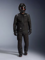 Alpinestars Cusco Drystar® Jacket, Black adventure motorcycle touring jacket, worn with matching black pants, full-face helmet, gloves, and boots, featuring technical ripstop construction and white Alpinestars branding