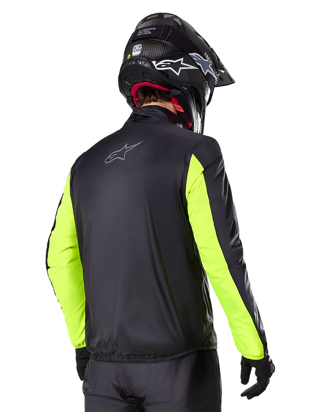 Alpinestars Bogotá Pro Drystar® Jacket, Rear view, Black with Yellow Fluo sleeves, worn by a rider with a black helmet and gloves, high-visibility adventure touring motorcycle gear with a technical textile finish.
