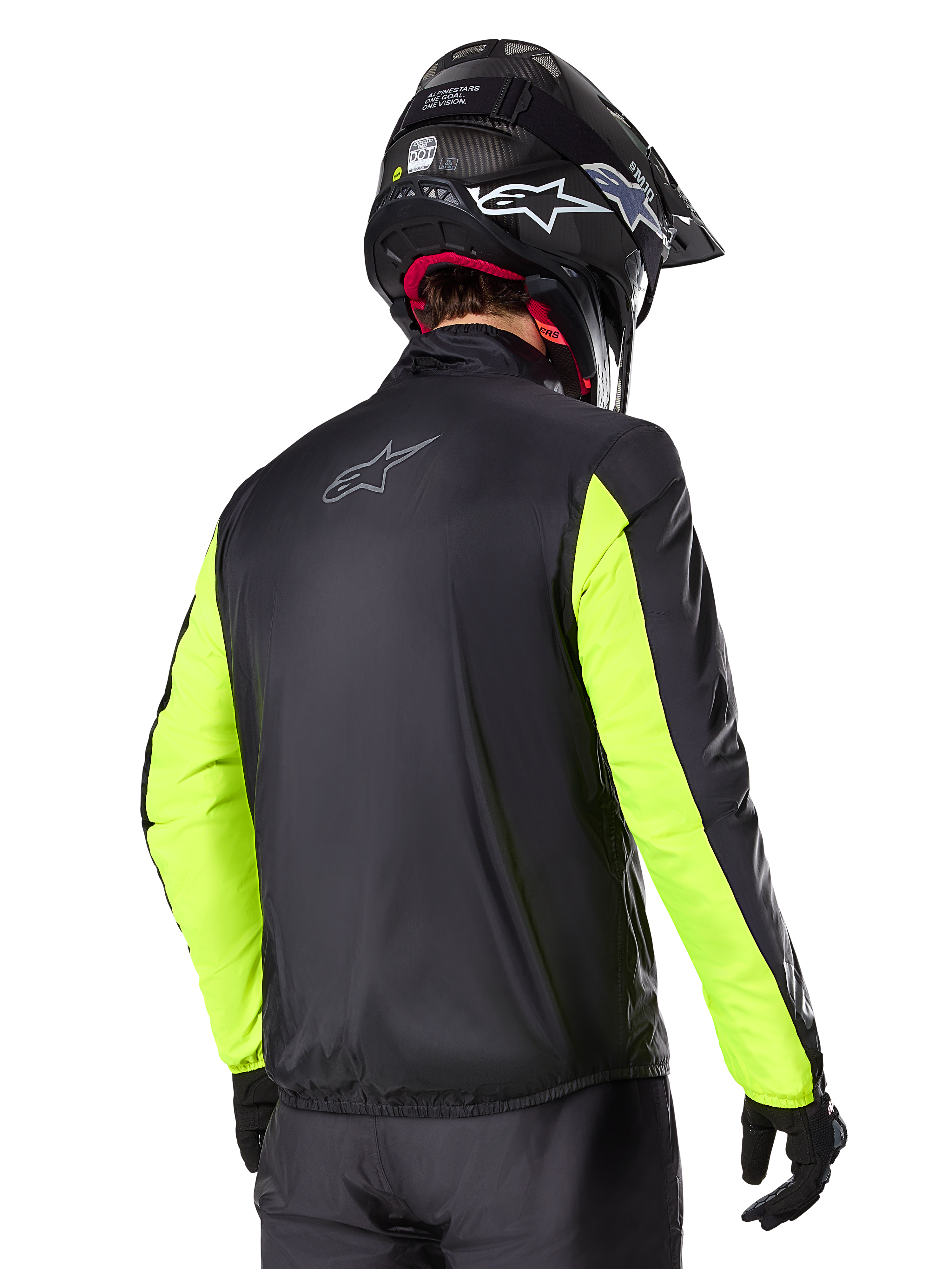 Alpinestars Bogotá Pro Drystar® Jacket, Rear view, Black with Yellow Fluo sleeves, worn by a rider with a black helmet and gloves, high-visibility adventure touring motorcycle gear with a technical textile finish.