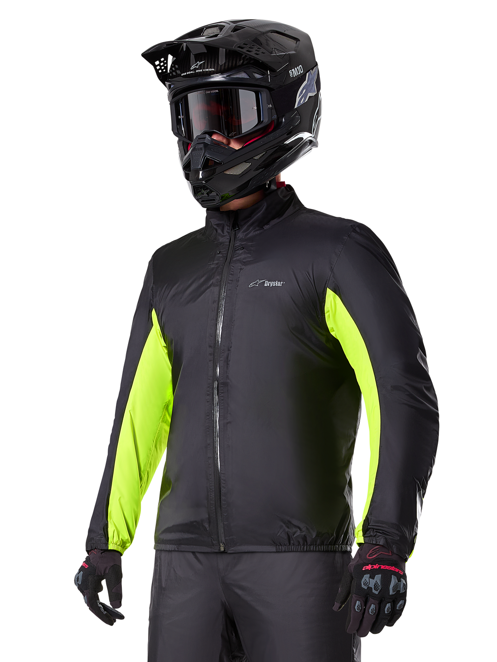 Alpinestars Bogotá Pro Drystar® Jacket waterproof liner, black with bright yellow fluo accents on the sleeves, worn by a rider with a black helmet and goggles, technical motorcycle apparel.
