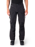 Alpinestars Hyde XT Drystar Pants, Black Adventure Touring Pants, worn by a rider with black boots, featuring grey logos on the thighs, integrated belt, reinforced knee panels, and waterproof textile construction.
