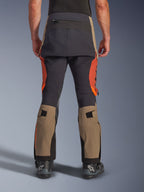 Alpinestars Halo Pro Drystar® XF Laminated Pants in Walnut Rust Black, rear view, adventure motorcycle pants featuring walnut tan and rust orange panels with black seat reinforcement, includes zippered back pocket and adjustable calf volume straps