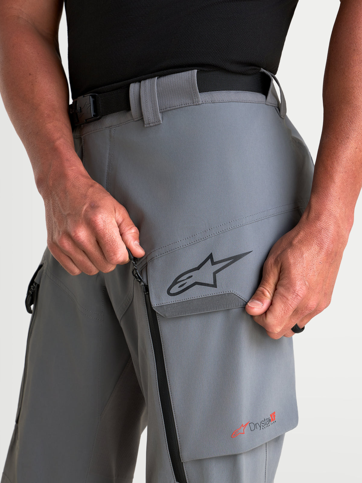 Alpinestars Maxdura Drystar XF Laminated Pants, Men's Adventure Motorcycle Pants, Dark Gray, featuring thigh cargo pocket, zippered ventilation, and Drystar XF branding close-up