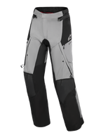 Alpinestars Andes V4 Drystar® Pants, Adventure Motorcycle Pants, Black and Dark Gray, featuring reinforced black knee and shin panels, zippered thigh vents, and cargo pockets, with a white Alpinestars logo on the hip, designed for all-weather road and adventure riding.