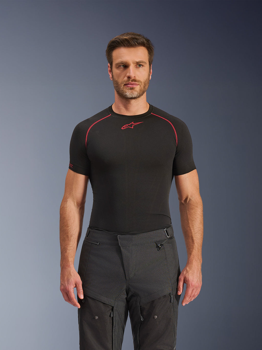 Alpinestars Cusco Drystar® Pants, Adventure Motorcycle Pants, Black, technical textile construction with zippered ventilation and ripstop panels, worn by a male model with a black Alpinestars base layer shirt for a complete adventure riding look