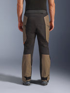 Alpinestars Cusco Drystar® Pants, Adventure Motorcycle Pants, Walnut Black, rear view on model, durable textile construction with color-blocked panels, adjustable hem, and zippered waist detail for touring and adventure riding