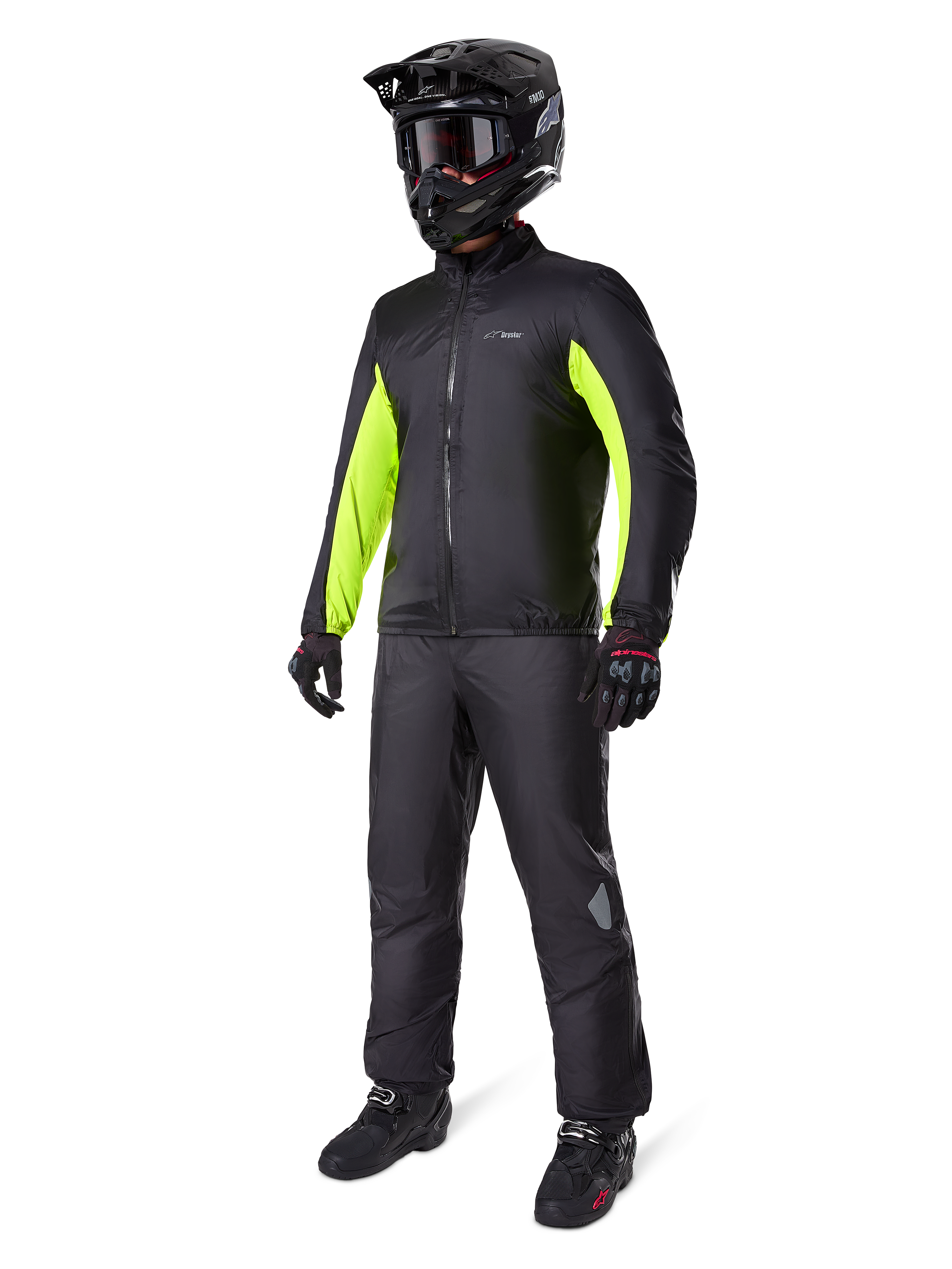 Alpinestars Bogota' Pro Drystar® 3 Seasons Pants, Black, rider wearing full adventure touring gear including a black jacket with neon yellow accents, black helmet, gloves, and boots, featuring the waterproof Drystar® membrane worn over the pants