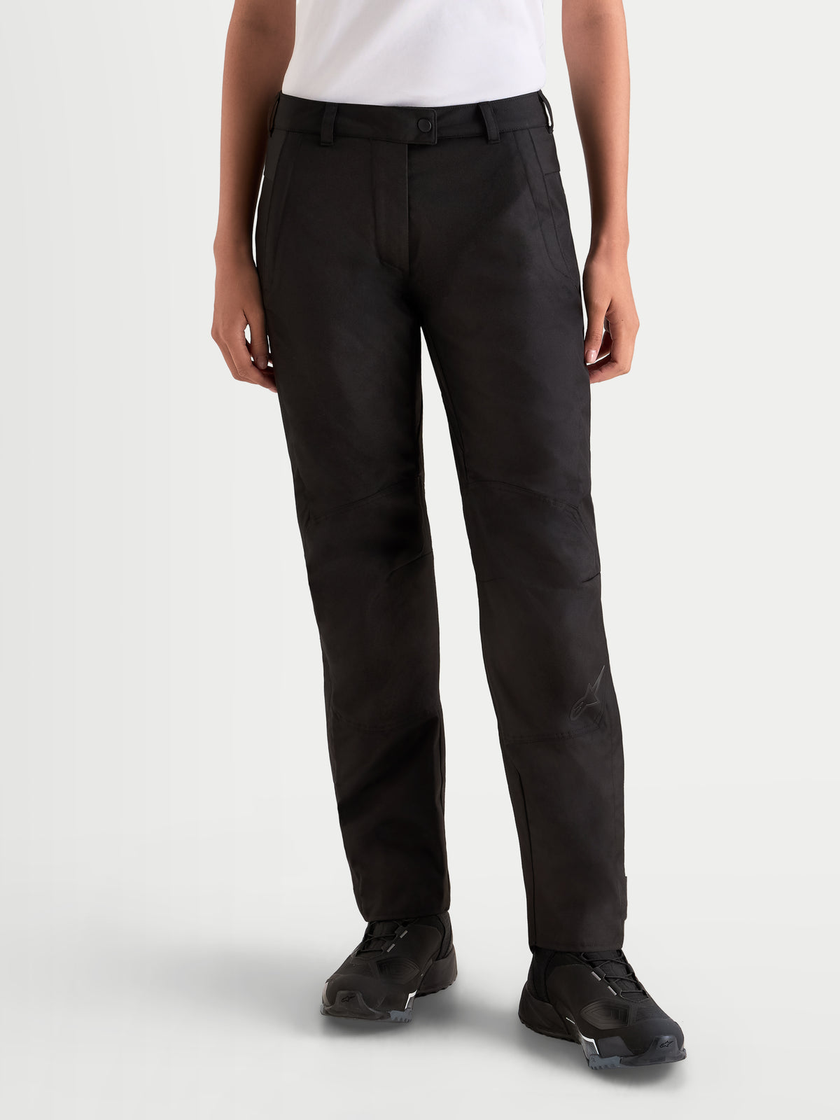 Alpinestars Stella C-1 Waterproof Pants, women's urban contemporary motorcycle riding pants in black, straight-leg textile construction with ergonomic knee area, worn by a model.