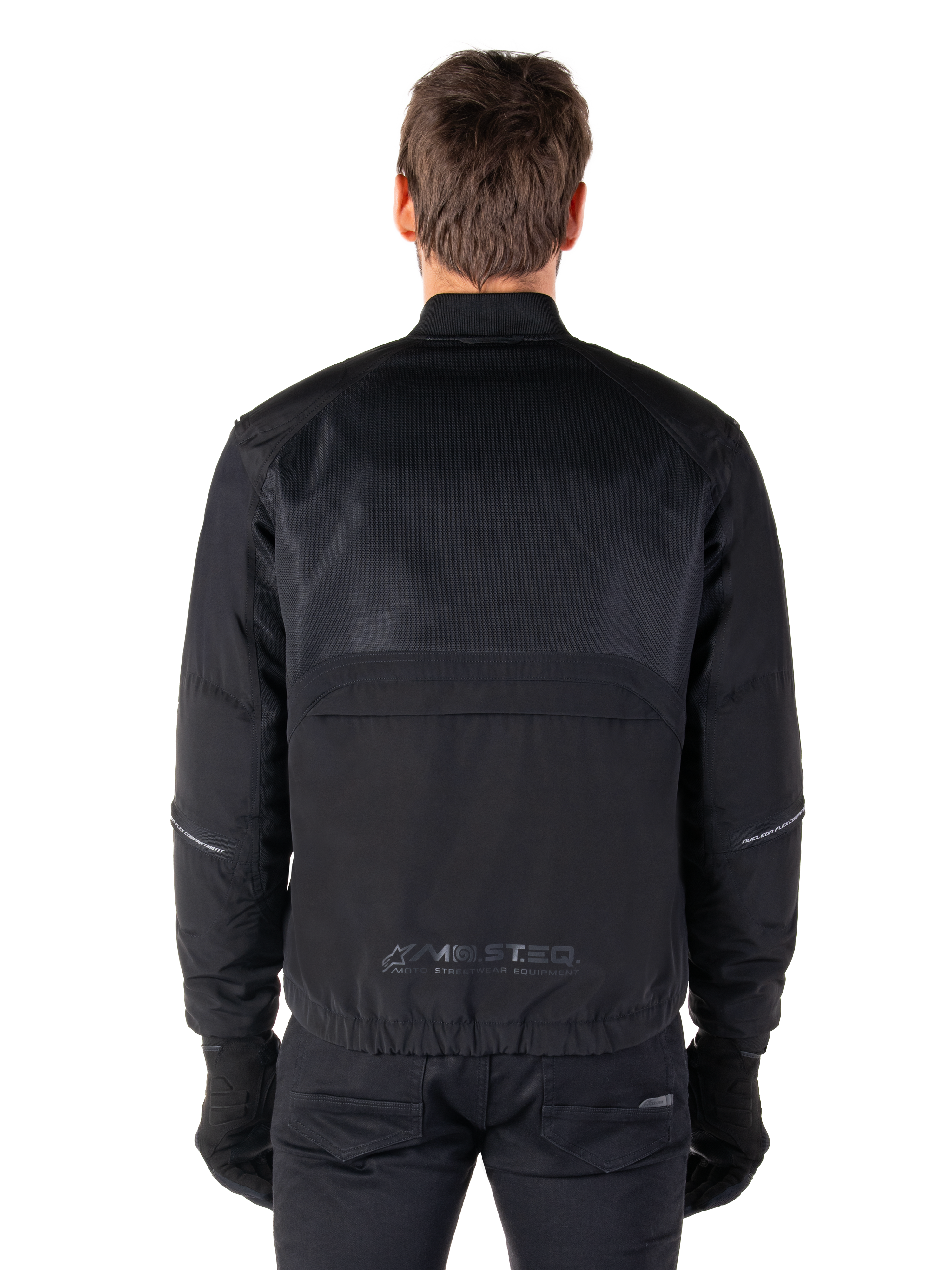 Alpinestars Mootant Waterproof Parka, Black Motorcycle Jacket, Rear view showing mesh upper for airflow and MO.ST.EQ. reflective logo on the lower back, modular 4-season gear