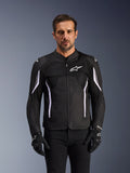 Alpinestars AST V3 Air Jacket, Motorcycle Jacket, Black Dark Gray and White, worn by a man with matching black gloves, featuring technical mesh panels for airflow and sport-fit construction for warm-weather riding
