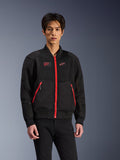 Alpinestars Flight Air Jacket in Black and Bright Red, urban bomber-style motorcycle jacket worn by a model, featuring mesh ventilation panels, a prominent red front zipper, red pocket details, and chest branding, styled with black pants