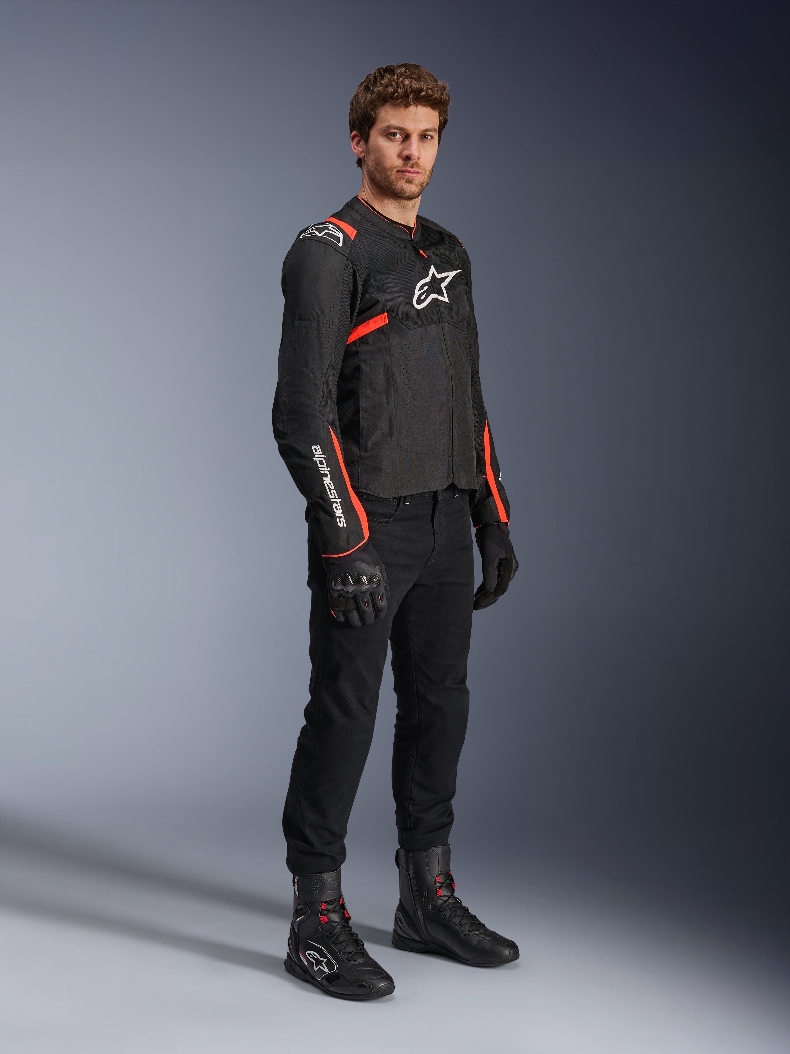 Alpinestars T-SPS Air V2 Jacket, men's black and red fluo textile motorcycle jacket with ventilated mesh panels.