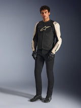 Alpinestars T-SPS Air V2 Jacket, Black Mastic Aluminum, worn by a model with black riding pants and gloves, ventilated textile motorcycle jacket with mesh panels and sporty design, full-body studio shot.
