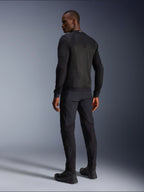 Alpinestars Troop-Air Jacket, Black technical motorcycle air jacket, rear view featuring large mesh panels for superior ventilation, worn with matching black pants and riding boots, sleek urban contemporary design for summer riding.