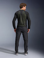 Alpinestars Troop-Air Jacket, Black Yellow Fluo, back view on a model, featuring a large 2D tech mesh back panel for ventilation, technical motorcycle jacket worn with black riding pants and boots, urban motorcycle style