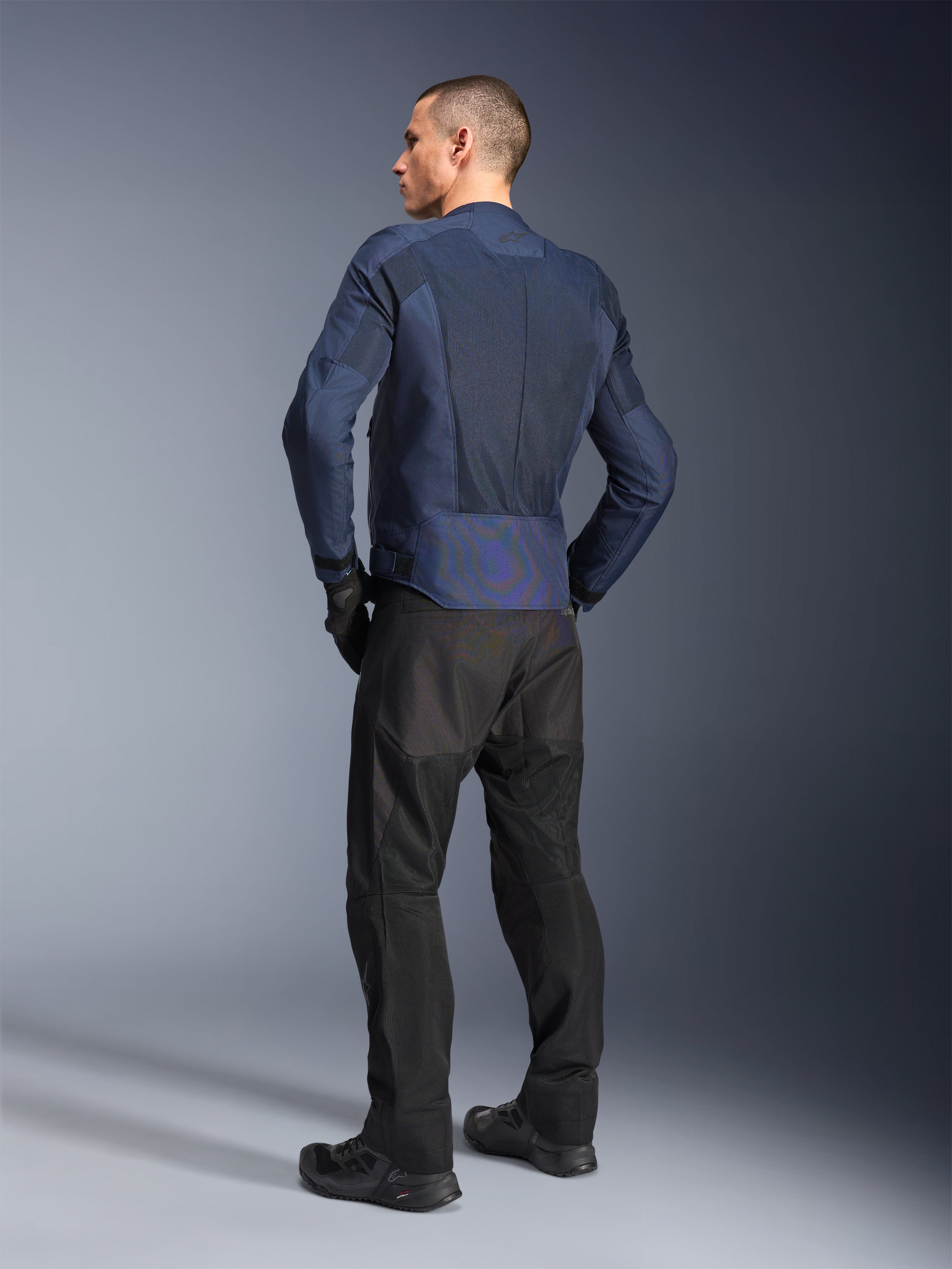 Alpinestars C-1 Air Jacket, Blue urban motorcycle jacket, rear view on man with mesh and reflective details.