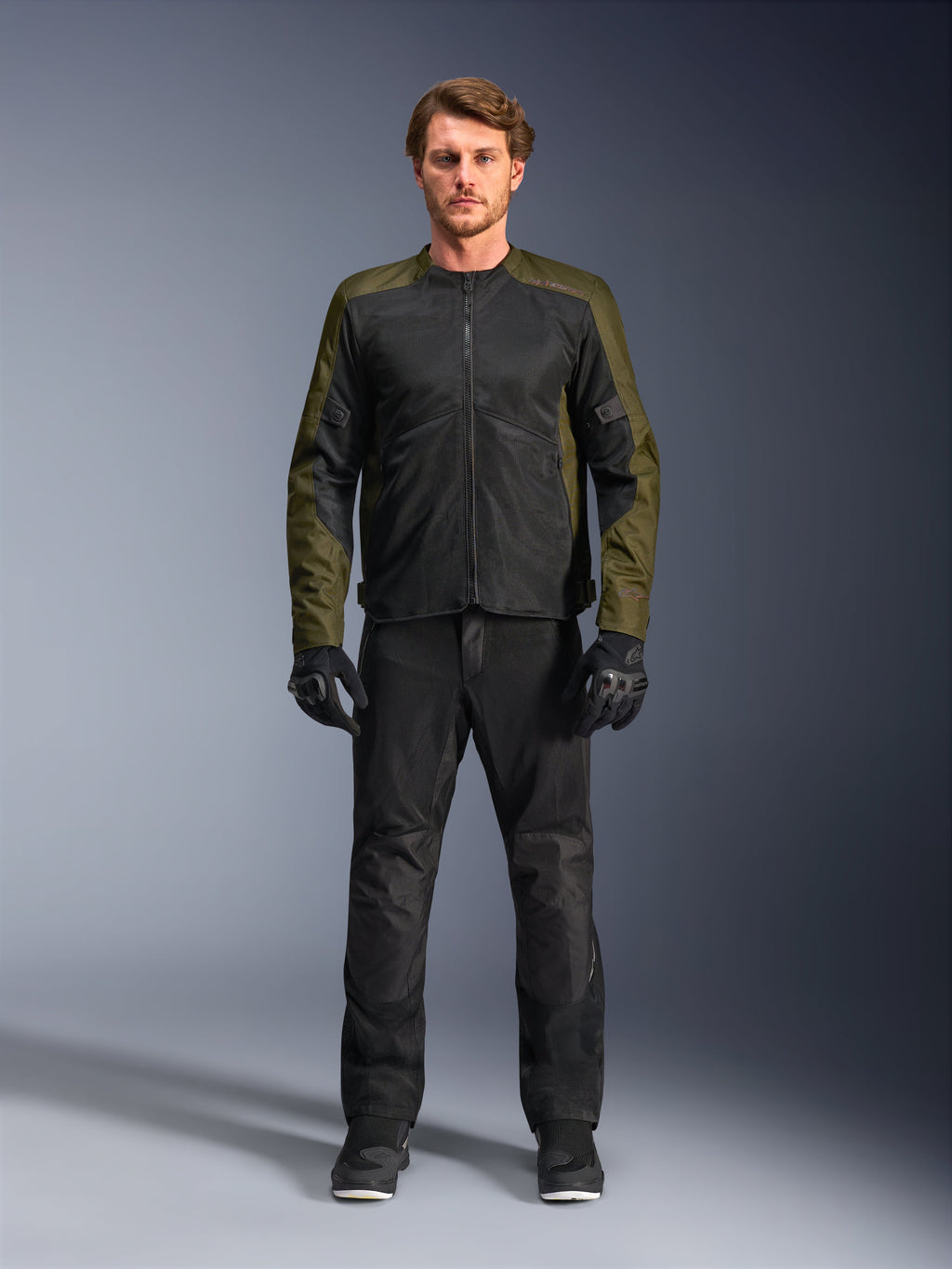Alpinestars C-1 Air Jacket, Khaki and Black, worn by male model with black motorcycle pants and gloves, lightweight textile design with tech mesh panels, urban contemporary riding gear