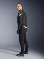 Alpinestars T-Stunt Air Jacket, Black and White, modular motorcycle jacket with tech mesh panels, shown from a back-side profile on a model, worn with black riding pants and shoes, featuring white accents and branding on the shoulders and back.