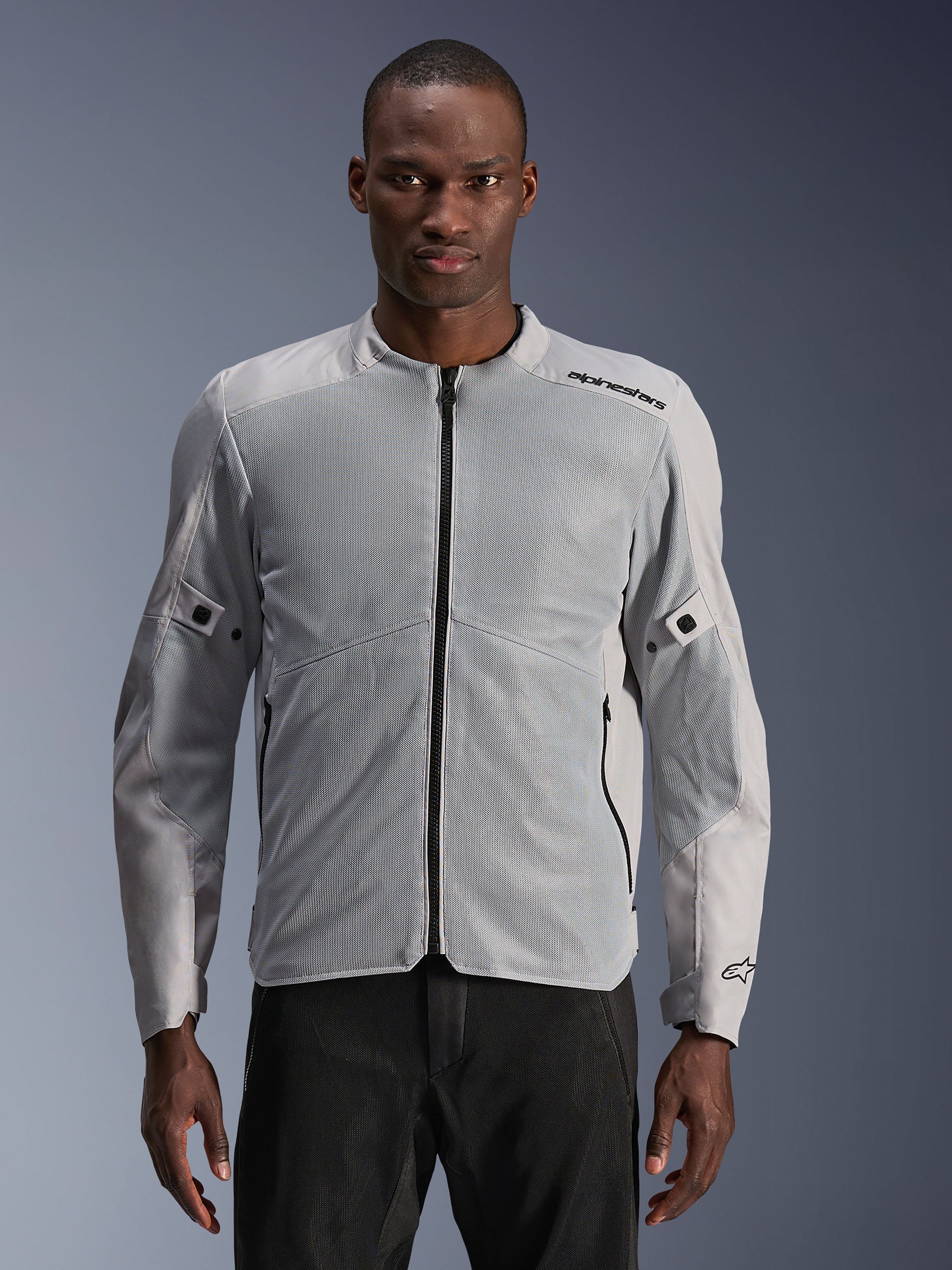 Alpinestars C-1 Air Jacket, Urban Motorcycle Jacket, Silver and Gray, featuring large tech mesh panels on the chest and sleeves, black central zipper, minimalist branding on the shoulder, lightweight and ventilated design for urban commuting