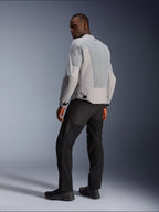 Alpinestars C-1 Air Jacket, Silver and Gray, viewed from the back on a model, featuring ventilated tech mesh panels and reflective logos, worn with black pants and shoes, urban contemporary motorcycle riding gear.